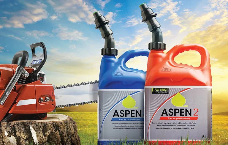 Bottles of Aspen 2 fuel in from of a chain saw