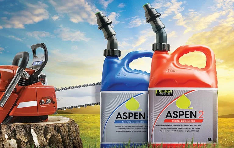 Bottles of Aspen 2 fuel in from of a chain saw 